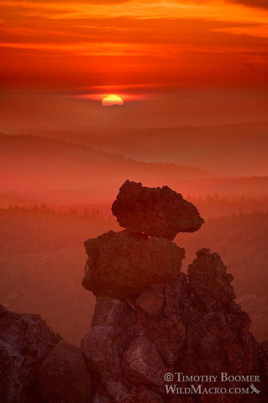 The sun sets over volcanic rock formations and rolling mountains near Carson Spur.  Eldorado National Forest, El Dorado County, CA.  Stock Photo ID=SCE0146